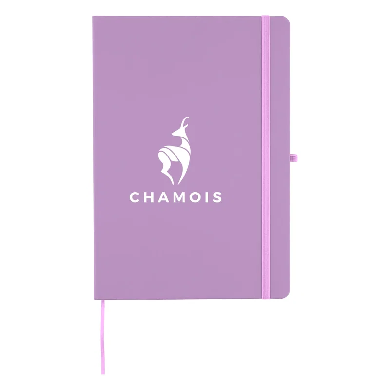 Notebook lying flat, ready to be opened at a desk