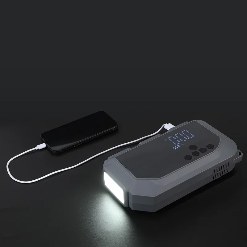 Side profile of the compact Revive Jump Starter with tire inflator and flashlight