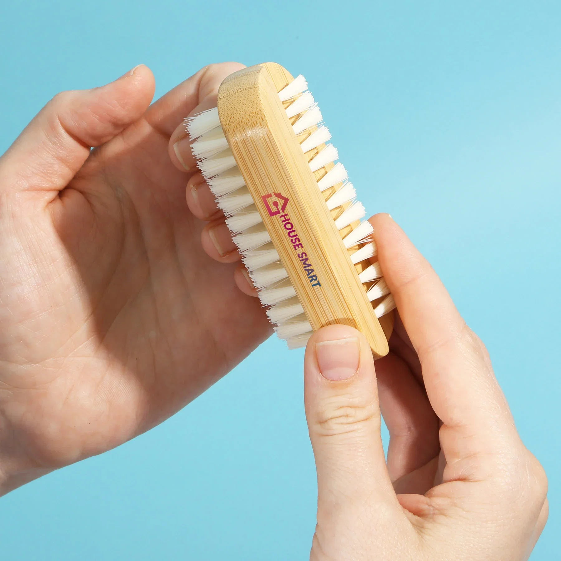 Revive Nail Brush held in hand