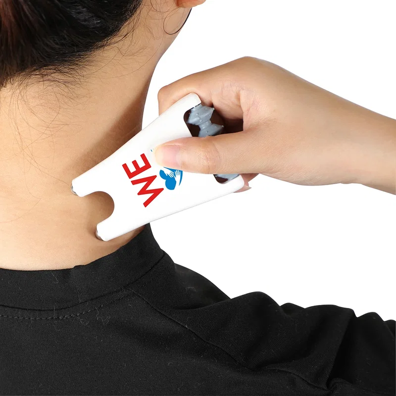 Rigger 2-in-1 Roller & Massager on a desk, branded lifestyle shot