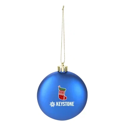 Flat round ornament measuring three inches across