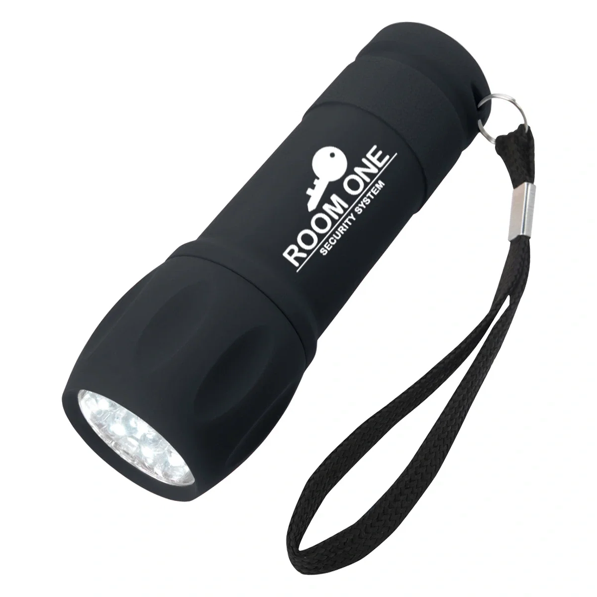 Black flashlight standing on end against a clean backdrop