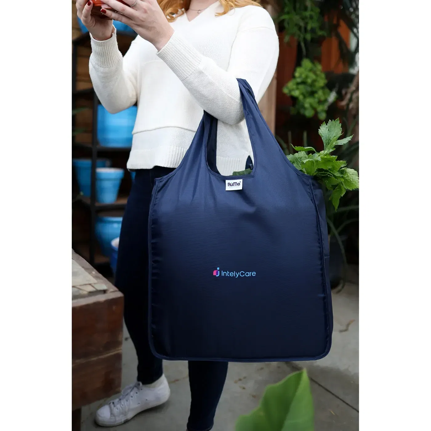 RuMe® Recycled Medium Tote held in hand