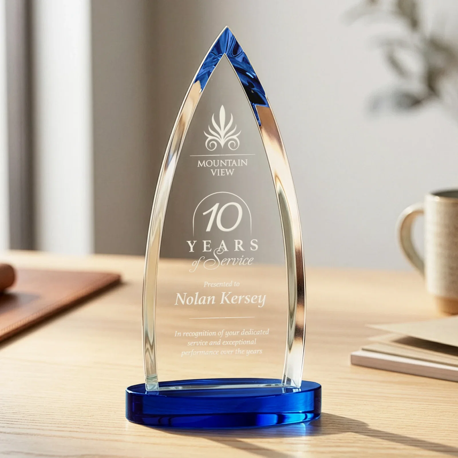 Branded Starfire Crystal Arrowhead Award on Round Crystal Base for team milestone celebrations
