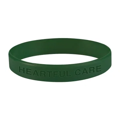 Navy wristband resting on a smooth flat surface