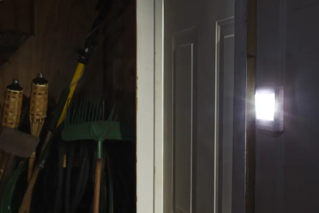 Side view of the branded Sleep-Tight night light showing its soft COB glow for nurseries and hallways