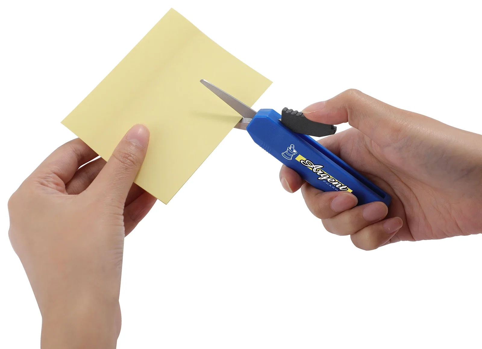 Slim Trim Travel Scissors being used to cut paper, in-use shot