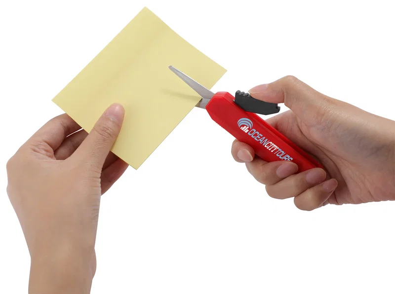 Slim Trim Travel Scissors packed inside a travel bag, lifestyle shot