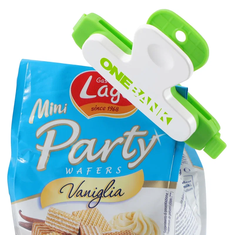 Snap-Lock Bag Clip used to reseal a bag of dry pasta stored inside a pantry cabinet