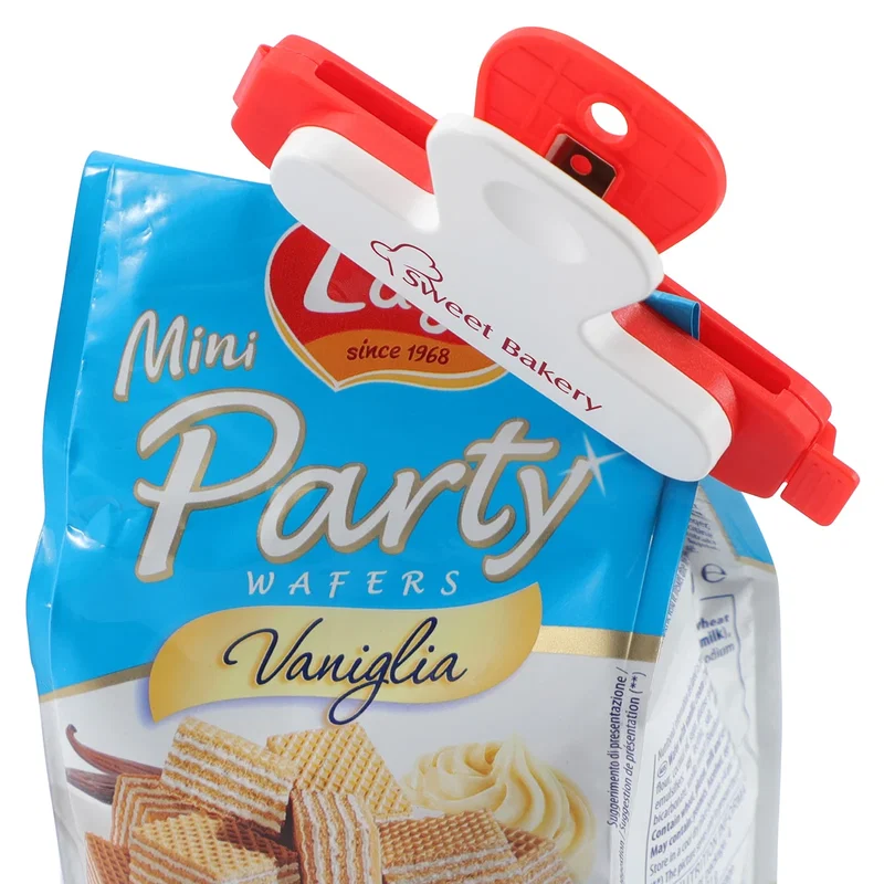 Snap-Lock Bag Clip shown unlatched with its jaw open before sealing a bag