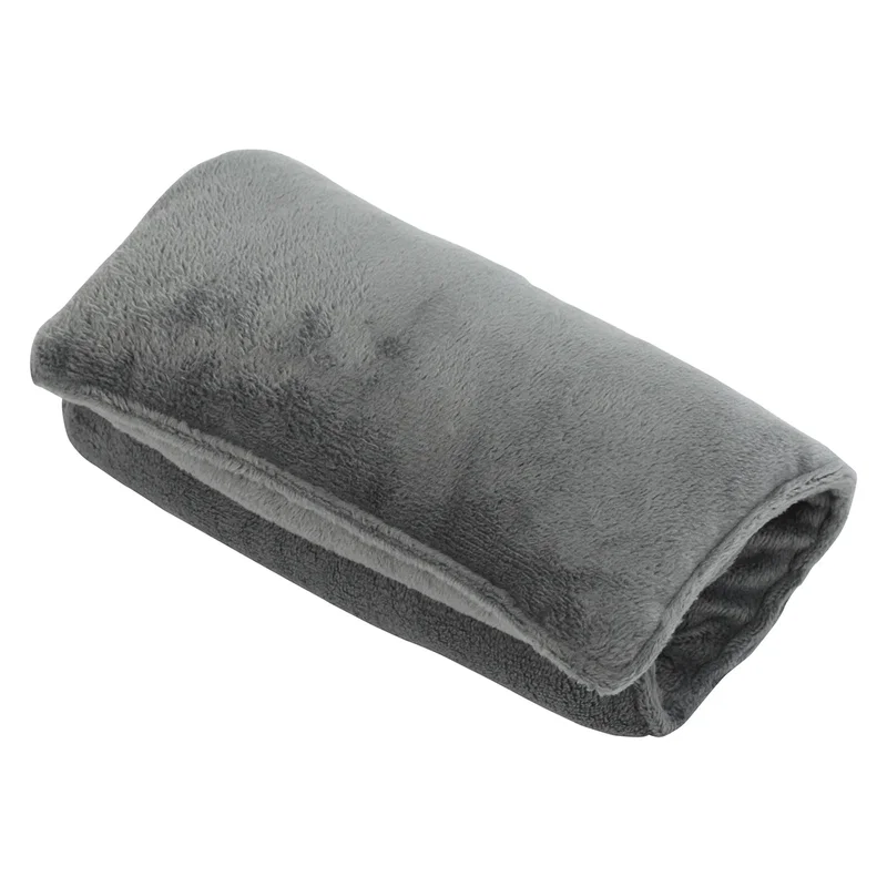 Solace Heat Therapy Pillow resting on a couch, lifestyle shot