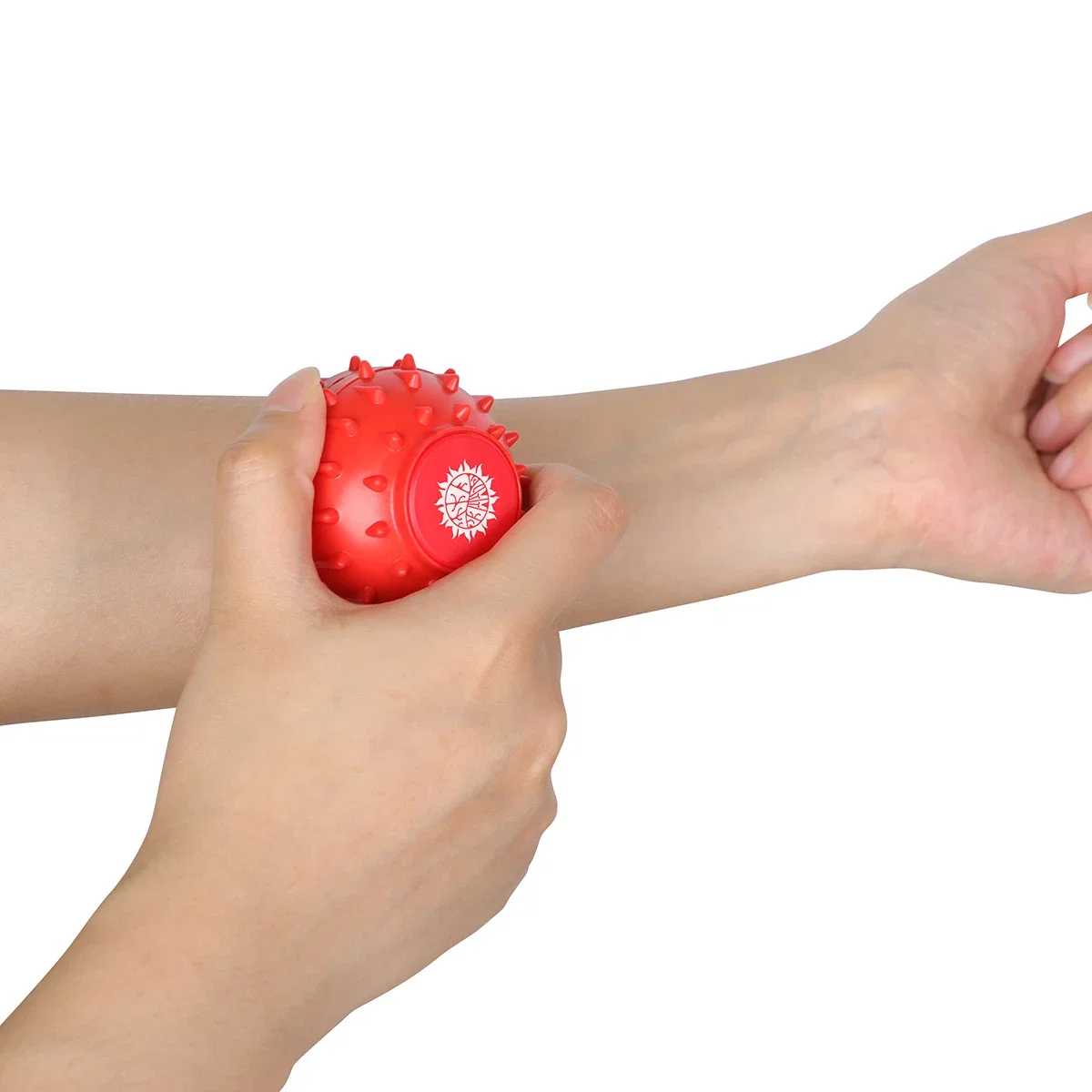 Promotional Spike Massage Ball in use, rolling over a sore muscle