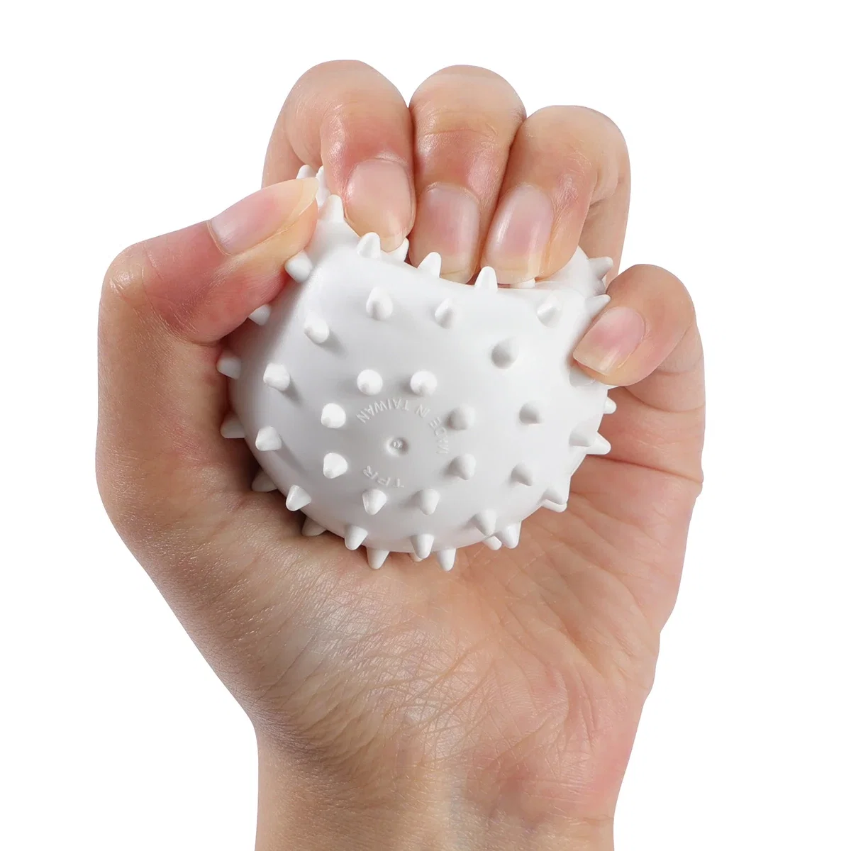 Angled view of the branded Spike Massage Ball showing its full spiked shape