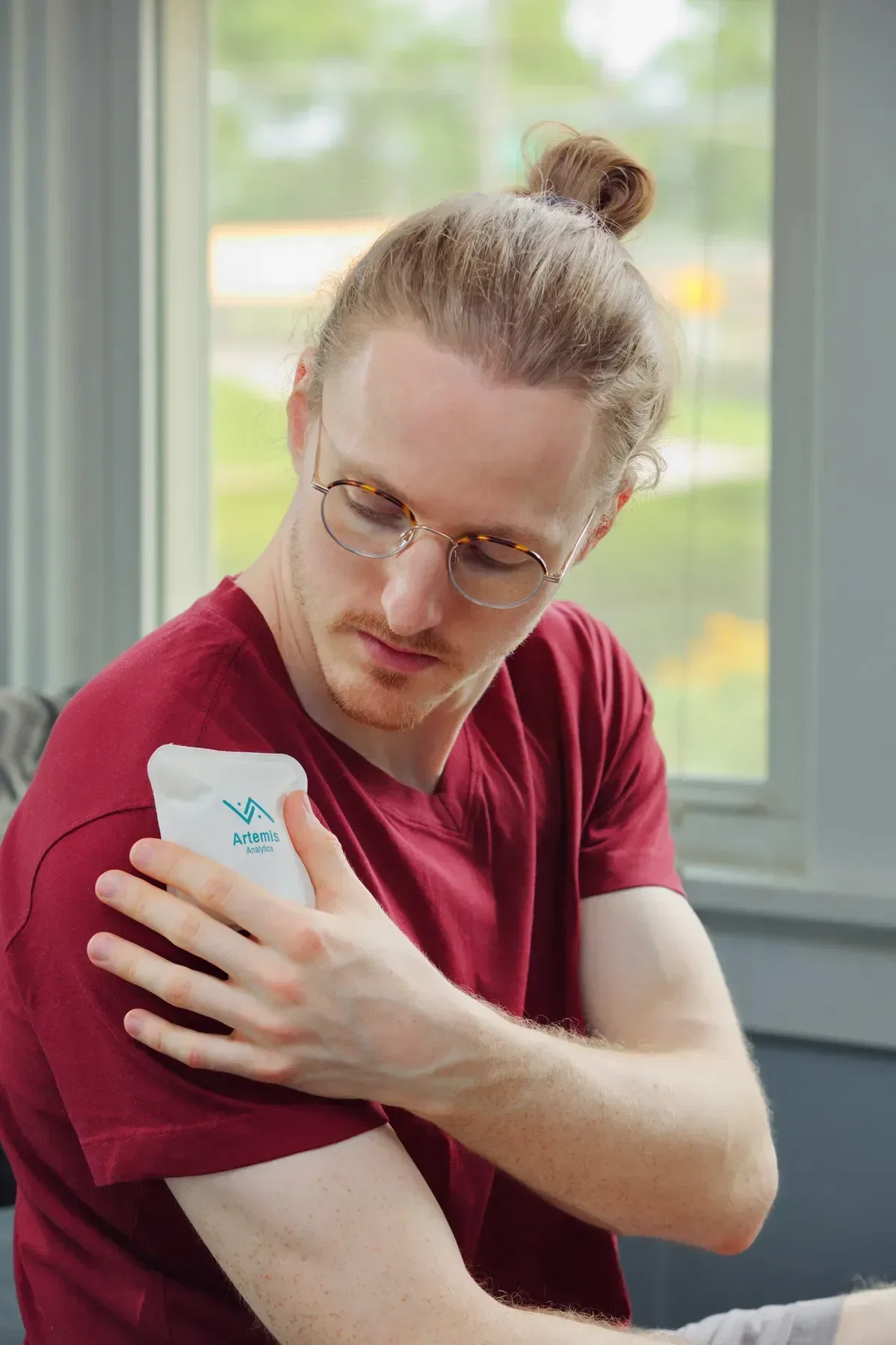 Square Nylon-Covered Hot/Cold Pack held in hand