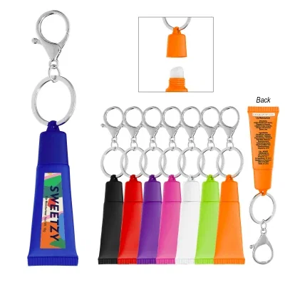 Squeeze tube of lip balm attached to a split key ring