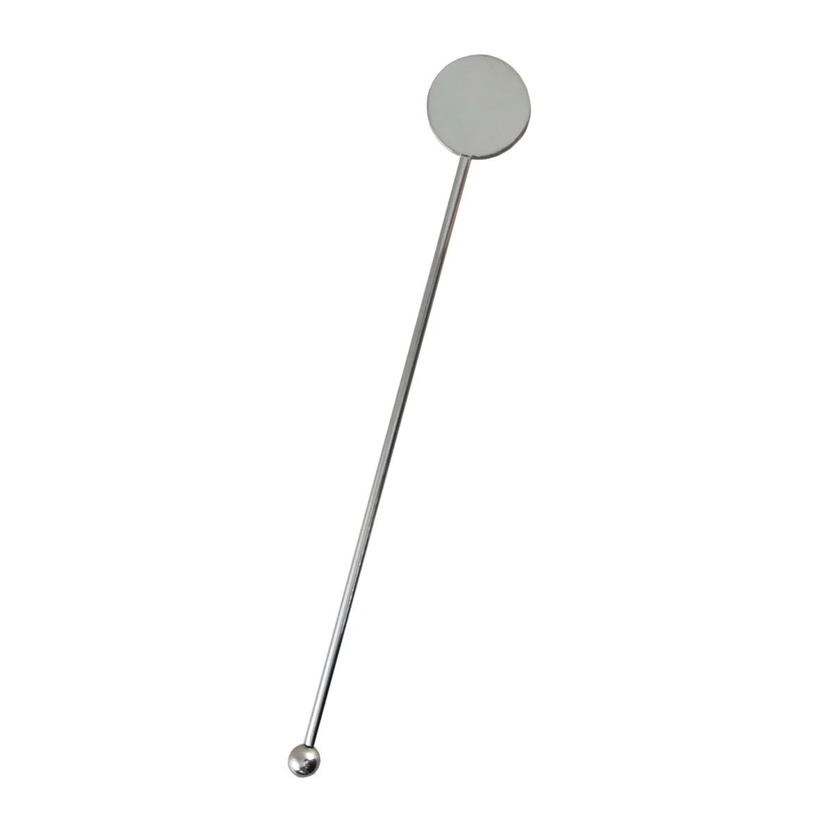 Stirrer resting inside a mixed drink glass