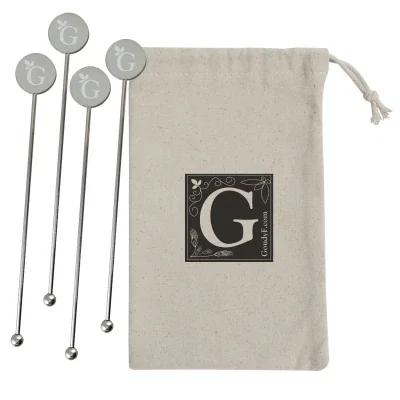 Stainless cocktail stirrers presented with a natural drawstring pouch