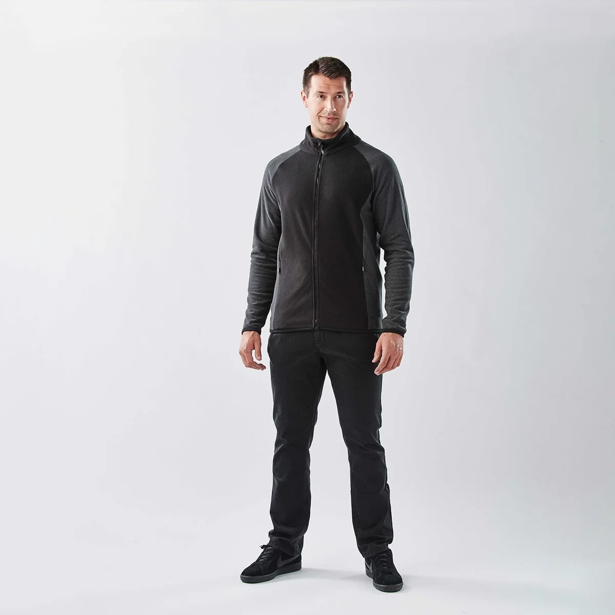 Zipper pull and collar detail on the soft fleece outerwear