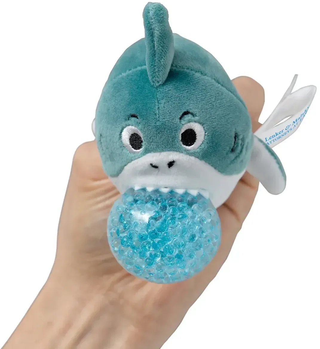 Promotional Stress Busters shark plush stress ball, close-up of imprint