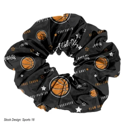 Fabric hair scrunchie shown from above on a plain backdrop