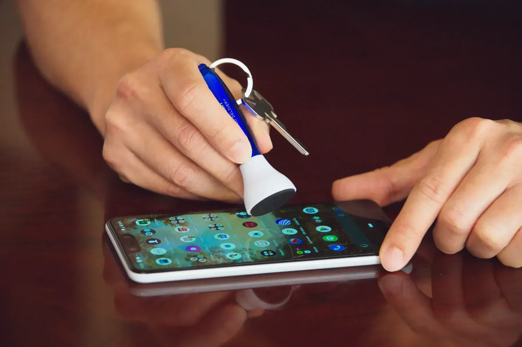 Swab 4-in-1 Earbud & Screen Cleaner in use
