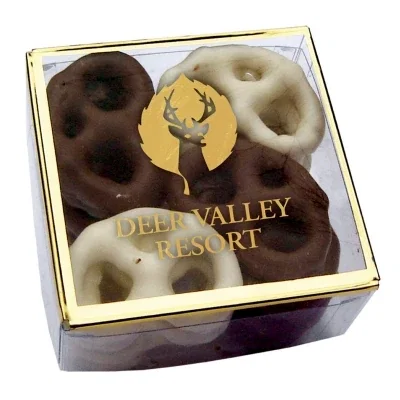Small square candy gift box measuring three inches across