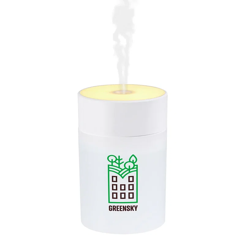 Angled view of the Swirl Portable Humidifier with Light showing its mist and glow