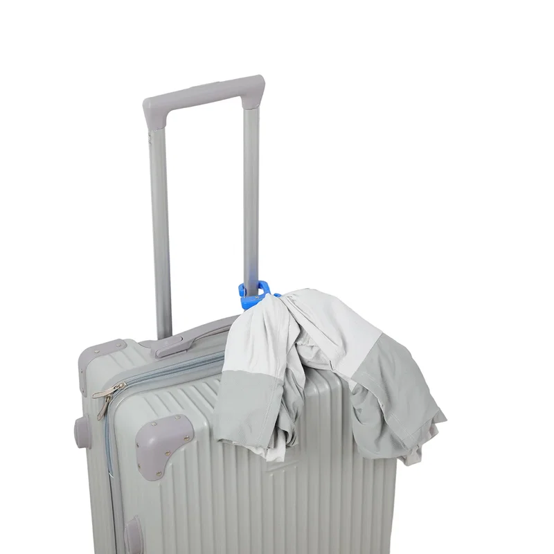 Swivel Clip Bag Hanger in use, branded bag hanger holding a purse under a table