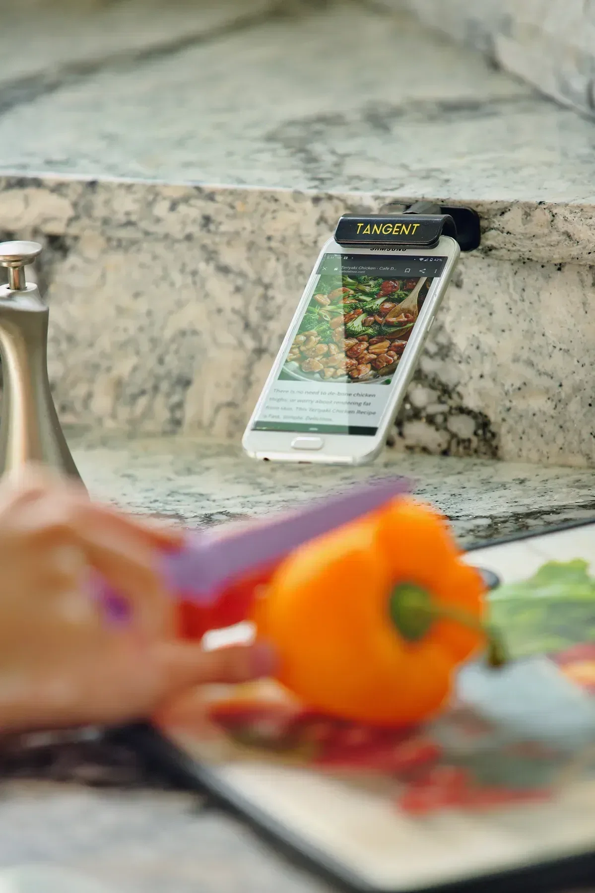 Tangent Adhesive Swivel Phone Stand in use