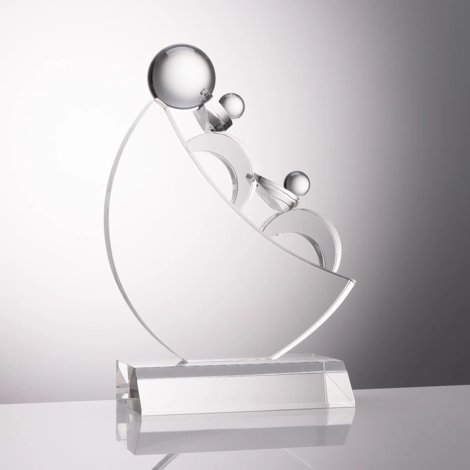 Custom Optical Crystal Award with Two Sculpted Figures Moving a Boulder, awards for corporate award ceremonies