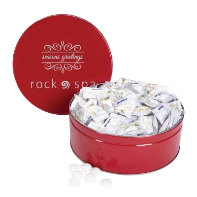 Shallow round tin holding individually portioned mints, about seven inches wide