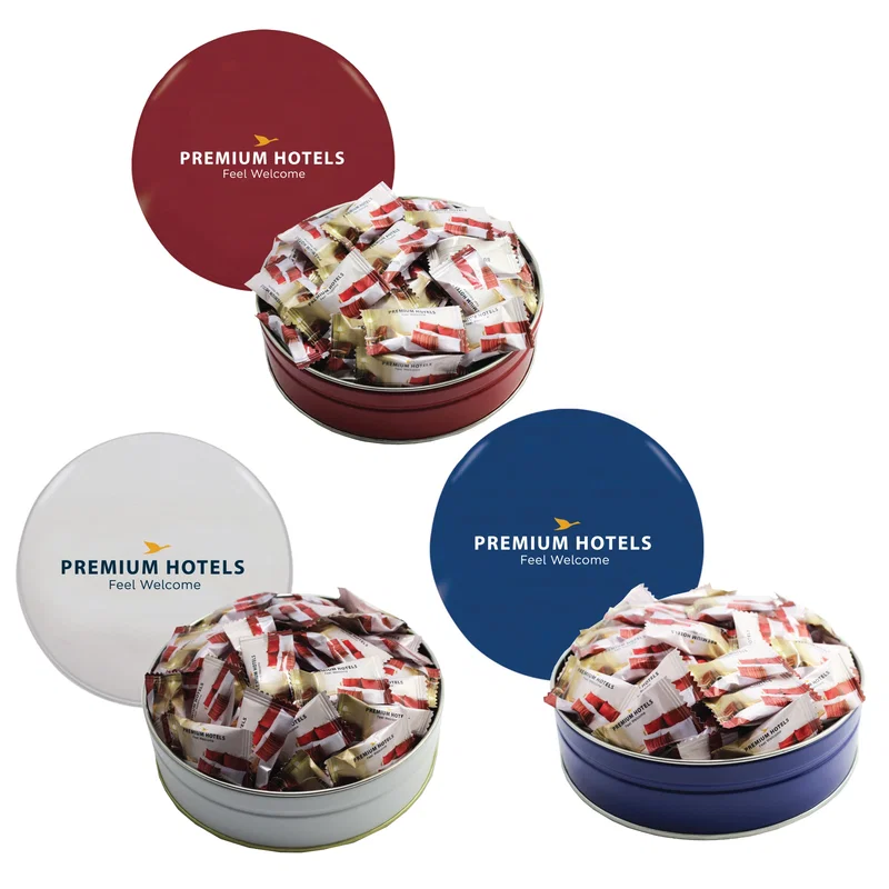 Lid of the mint tin lifted to reveal the candy inside