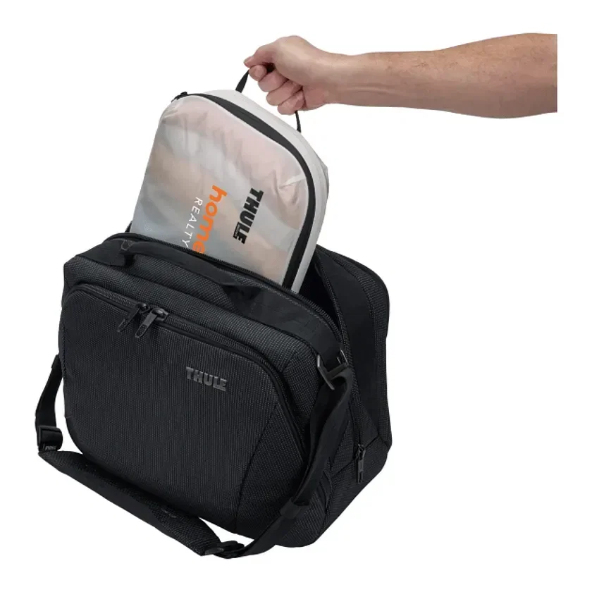 Branded Thule Packing Cube Set held in hand