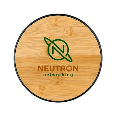 Round wireless charging pad with a bamboo top four inches across
