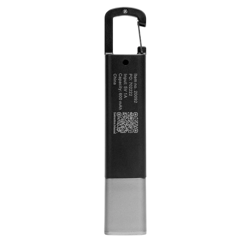 Held in hand to show the pen-sized scale of the lamp
