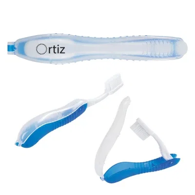 Folding travel toothbrush closed inside its compact case