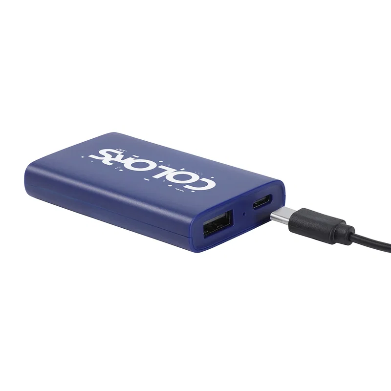 Triumph Power Bank in use, charging a smartphone via USB cable