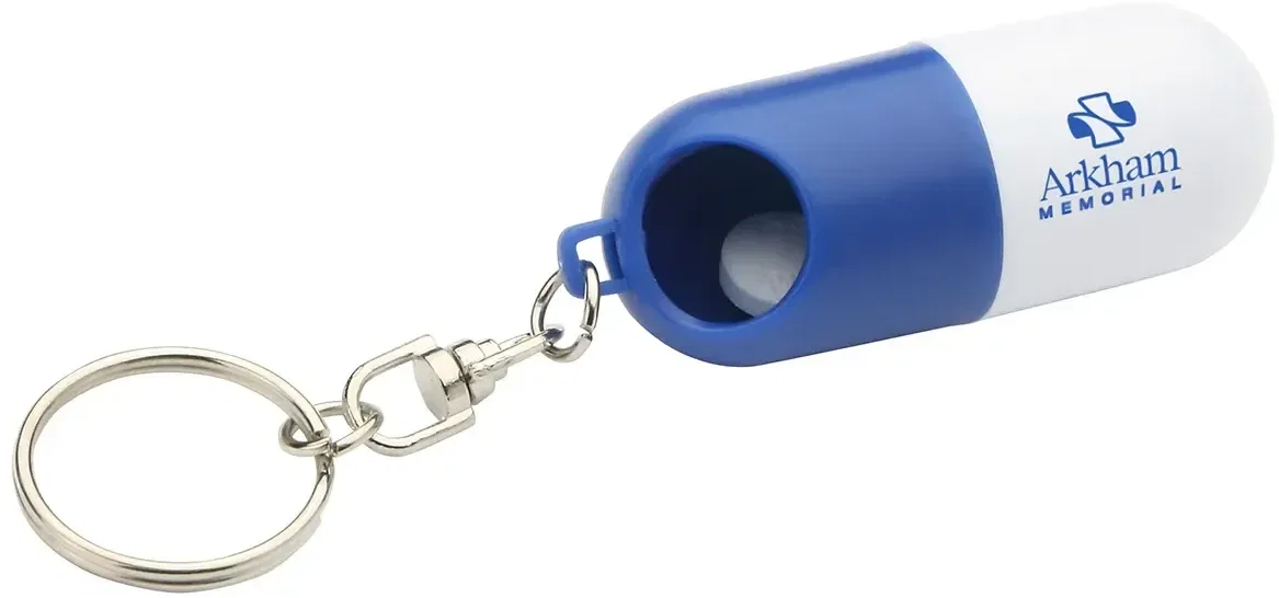Promotional Twist-A-Pill dispenser opened with the cap twisted off