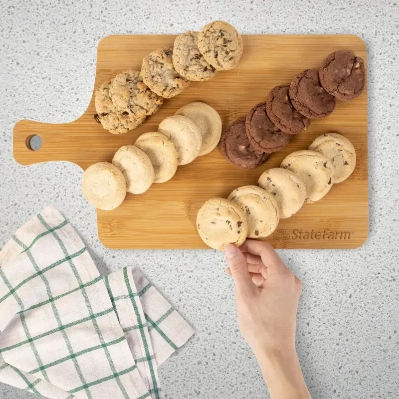 Ultimate Cookie Bamboo Charcuterie Board held in hand