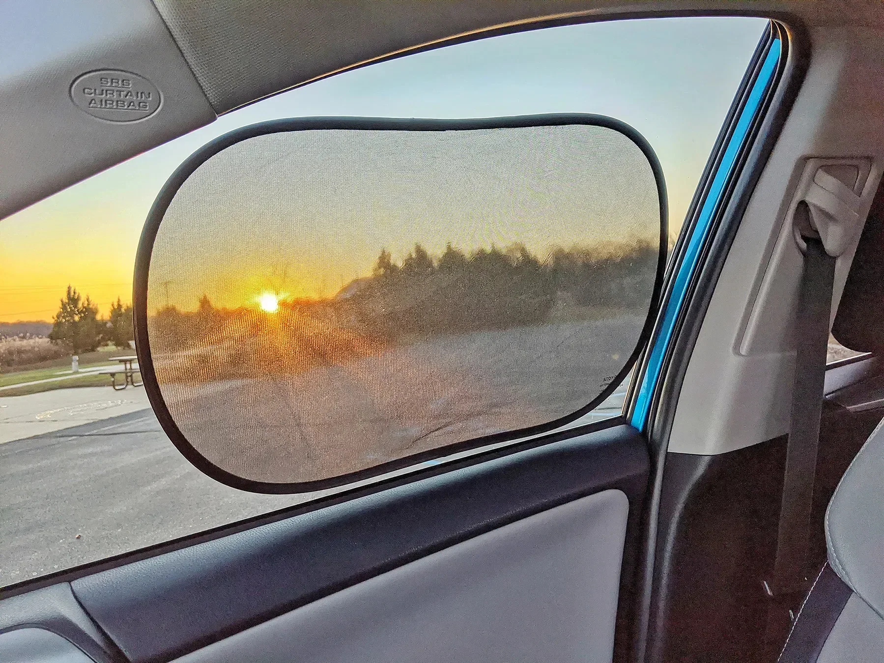 Umbra Car Sun Shade in car window, branded custom promotional sun shade for auto giveaways