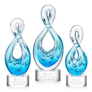 Blue Glass Award With a Twisting Infinity-Loop Silhouette