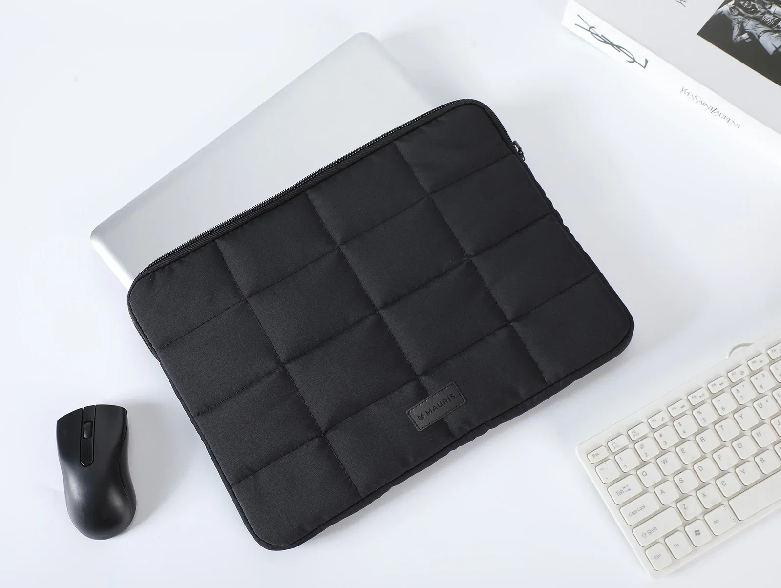 Promotional Vallum sleeve holding a 15-inch laptop, in-use lifestyle shot