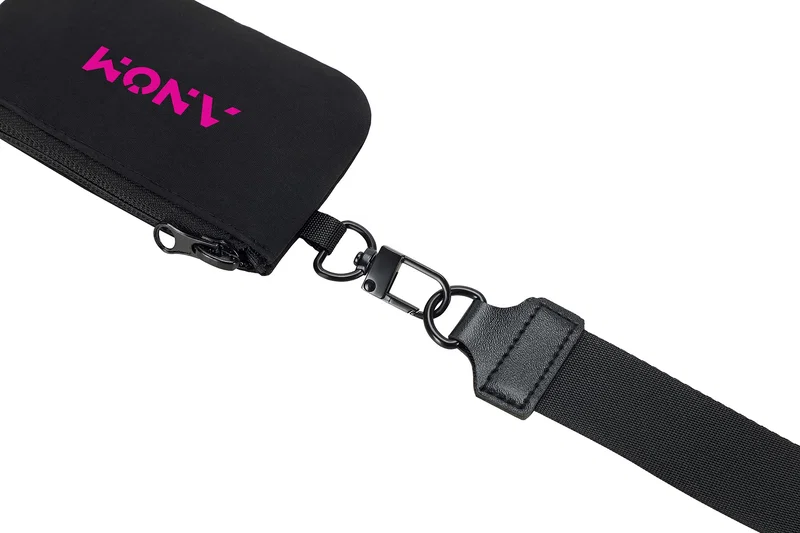 Close-up of the Vogue Wrist Wallet's zipper pull and swivel clip hardware
