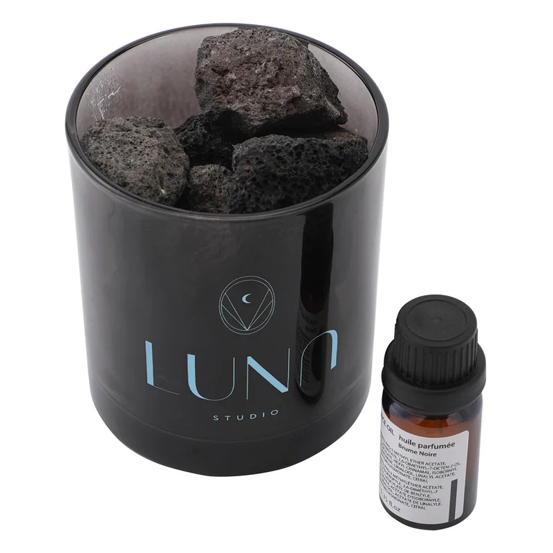 Branded Volcanic Rock Diffuser on a nightstand, lifestyle in-use shot