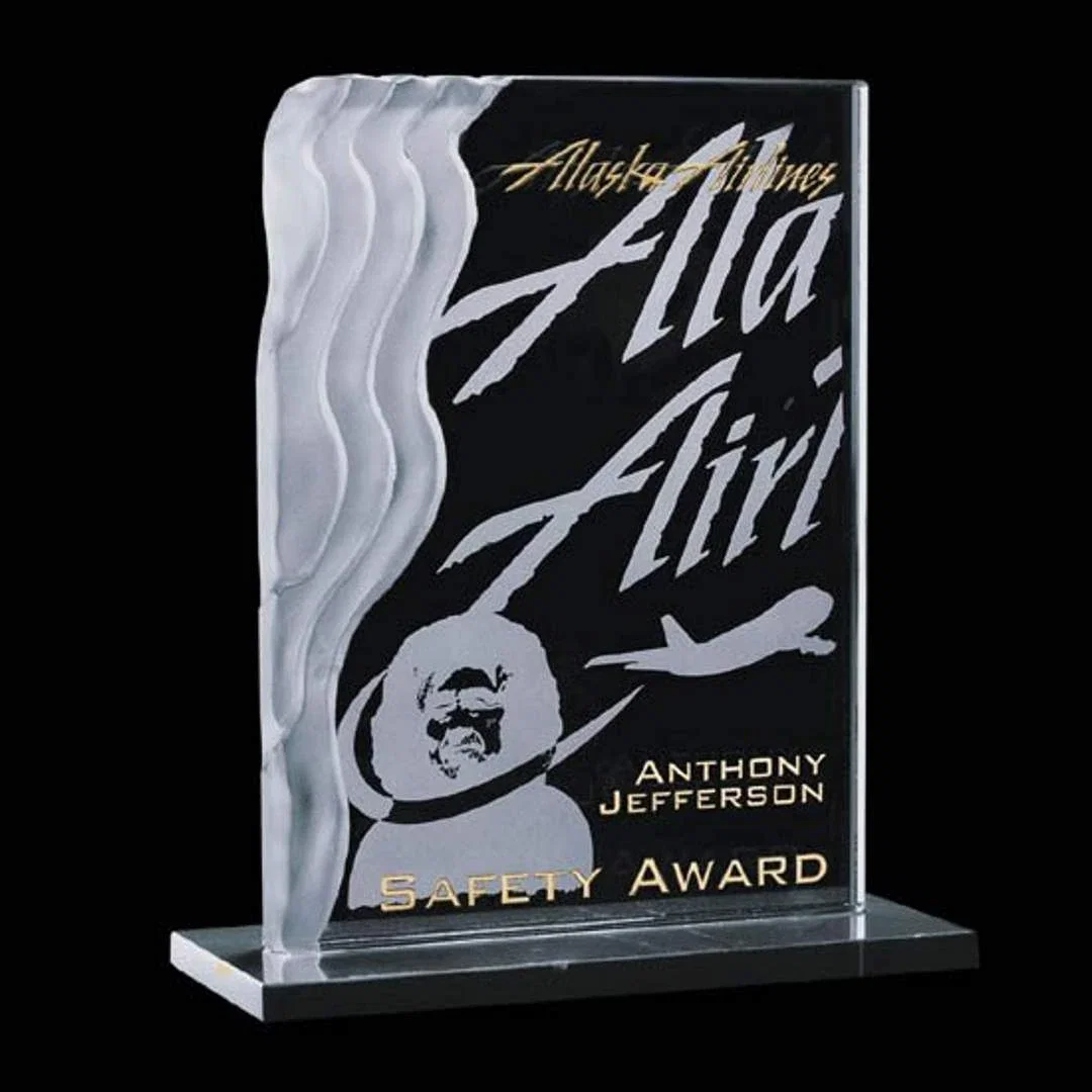 Custom Jade Glass Award With a Sculpted Wave Edge on a Marble Base for employee recognition