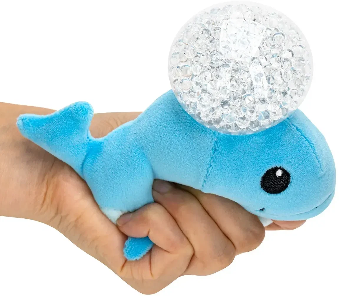 Custom whale plush stress ball held in hand, in-use view