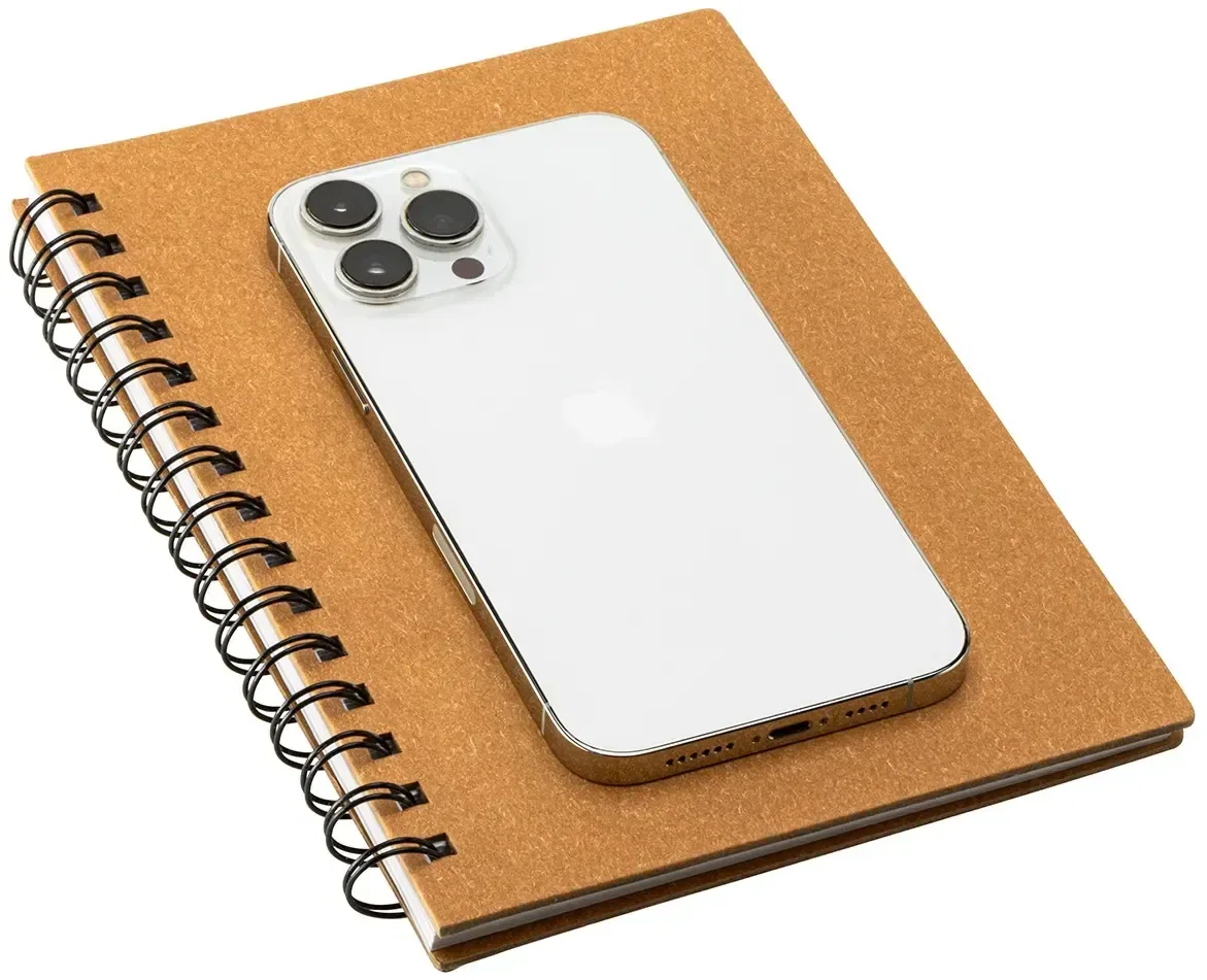 Branded hardcover spiral notebook opened flat, interior pages