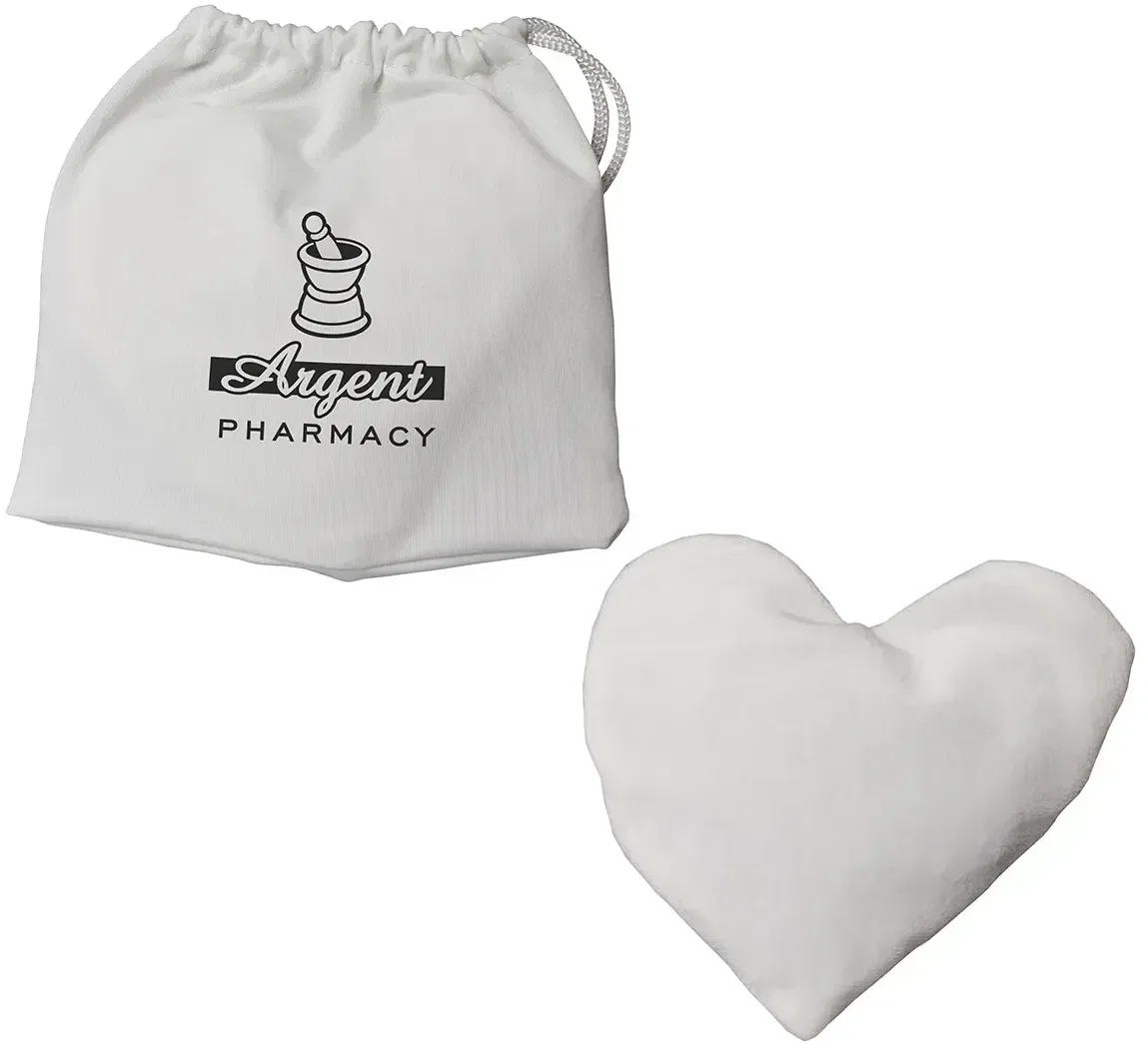 Close-up of the custom lavender heart heat pack showing its soft fabric and logo area