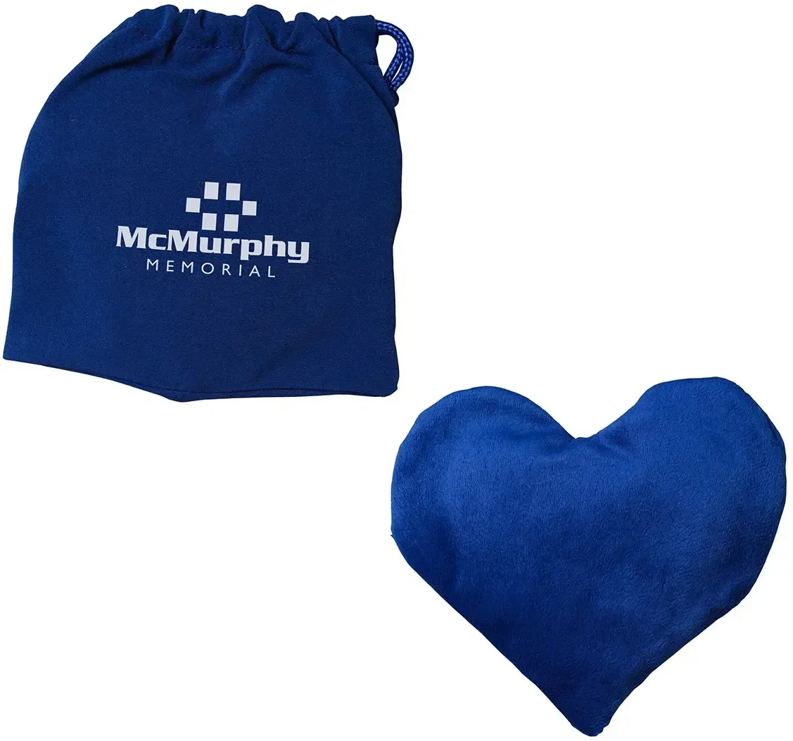 Promotional lavender heart heat pack held to show its heart shape and space for a branded logo