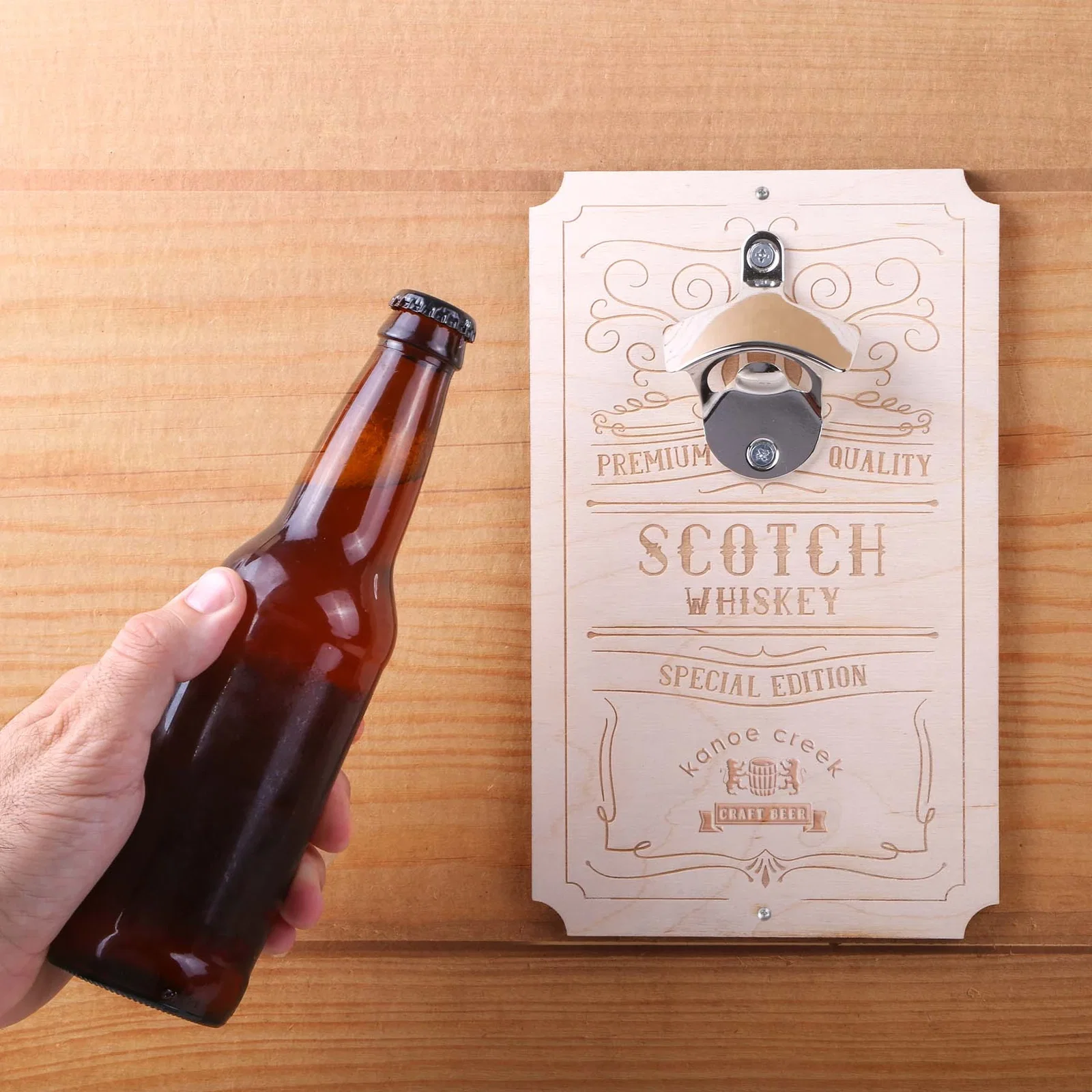 Wood Wall Mounted Bottle Opener held in hand